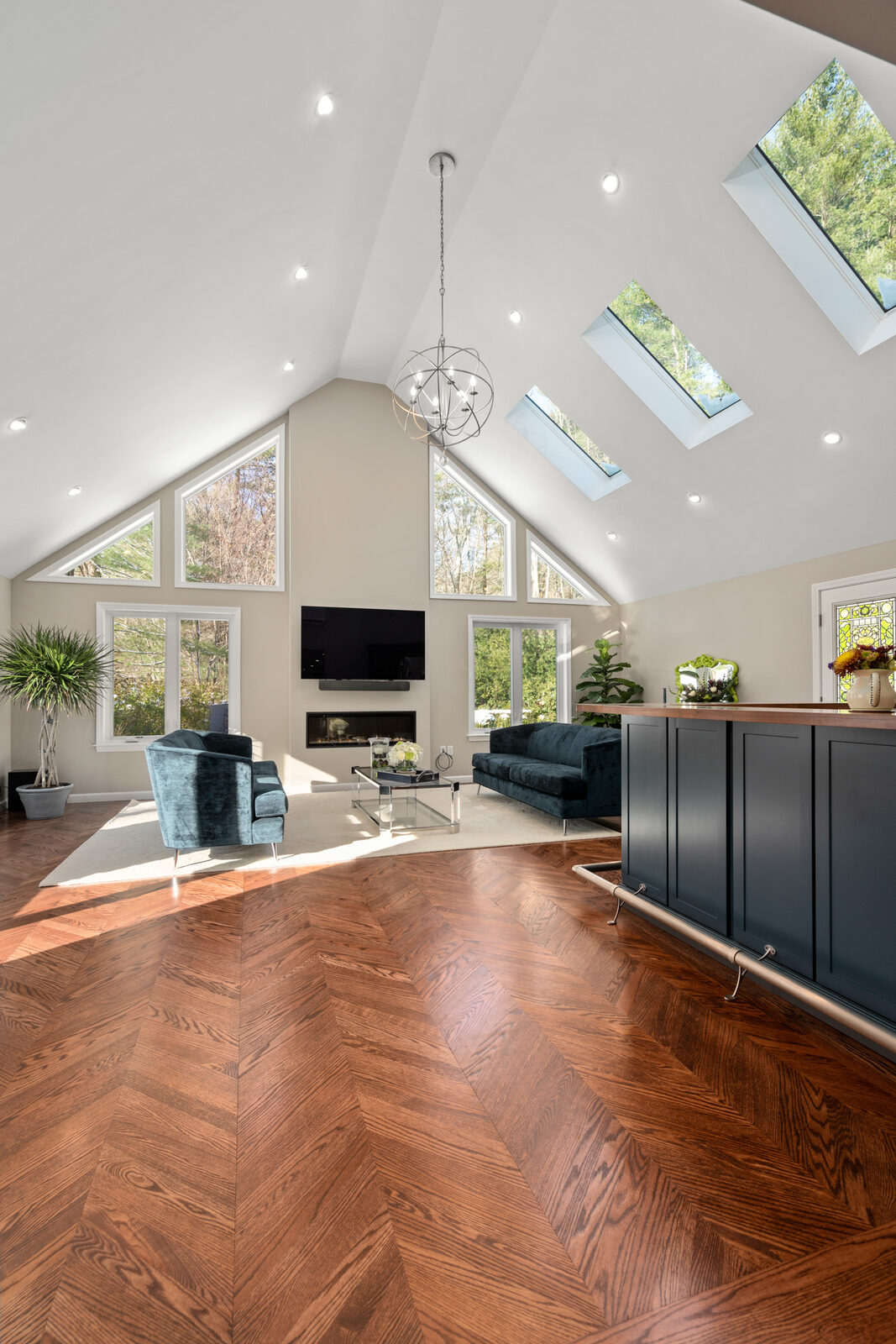 Home addition with a vaulted family room and custom millwork