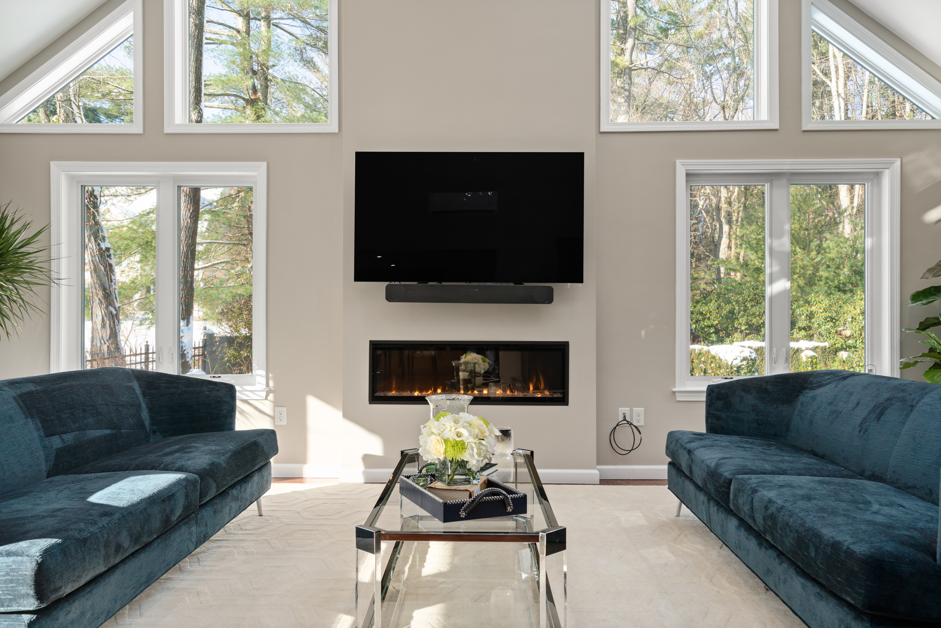 Renovated open living space by Masters Touch Design Build