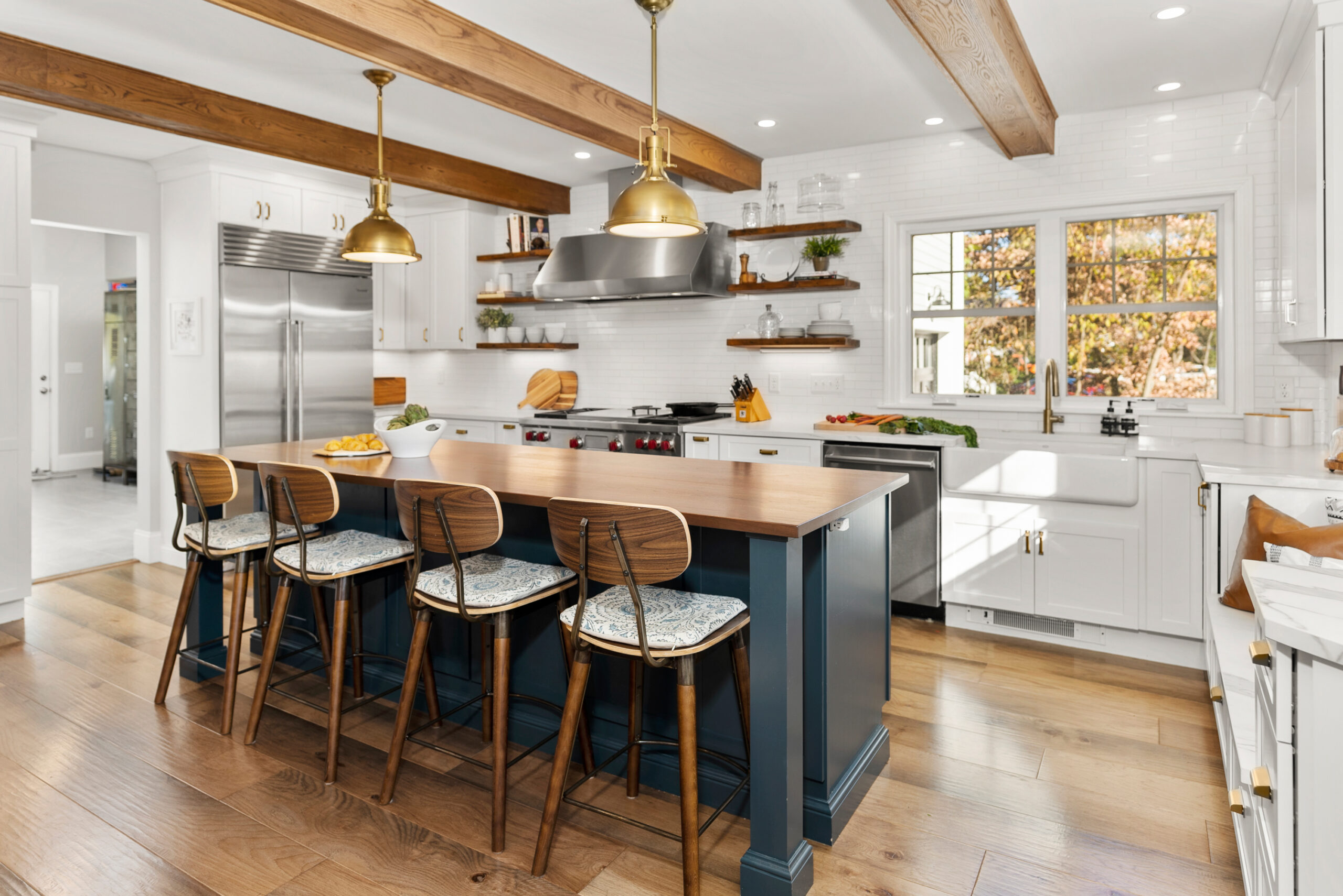 Kitchen remodel near Needham, MA with island seating and premium countertops